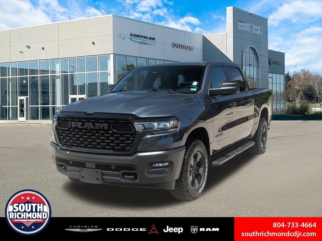 2026 RAM Ram 1500 RAM 1500 WARLOCK CREW CAB 4X4 5'7' BOX in Forged Blue Metallic Exterior Paint — front three-quarter view
