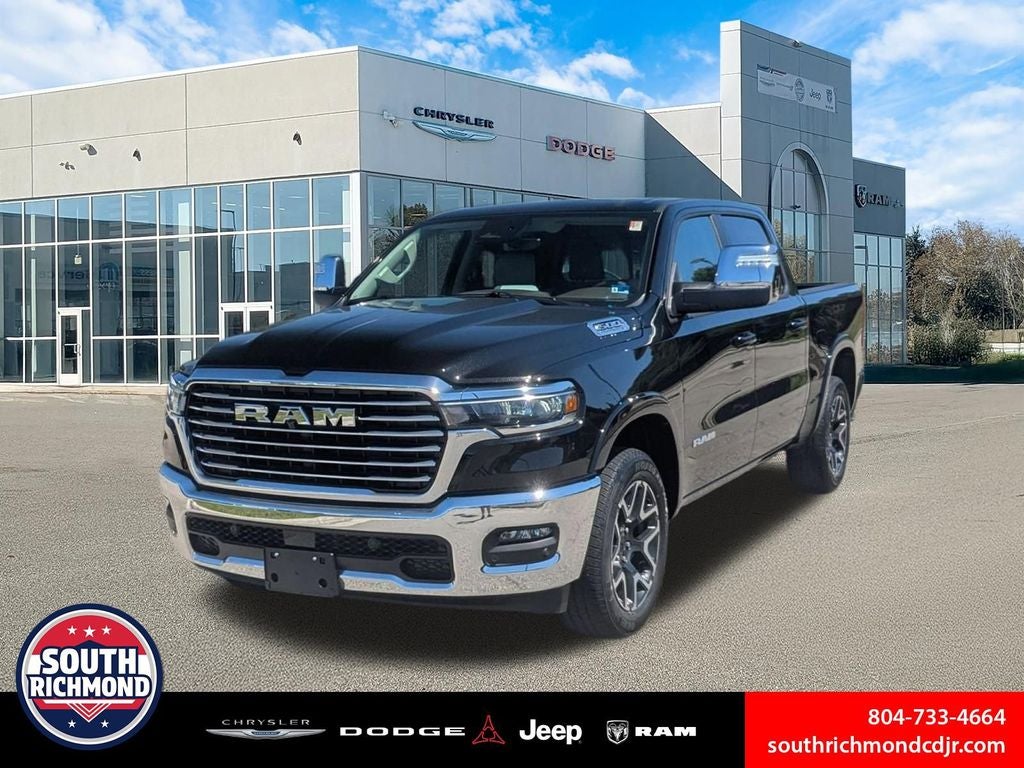 2026 RAM Ram 1500 RAM 1500 LARAMIE CREW CAB 4X4 5'7' BOX in Diamond Black Crystal Pearl-Coat Exterior Paint — front three-quarter view